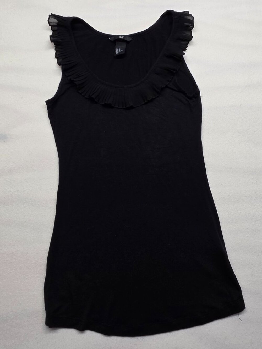 H&M black Sleeveless top with ruffle around the neck XS